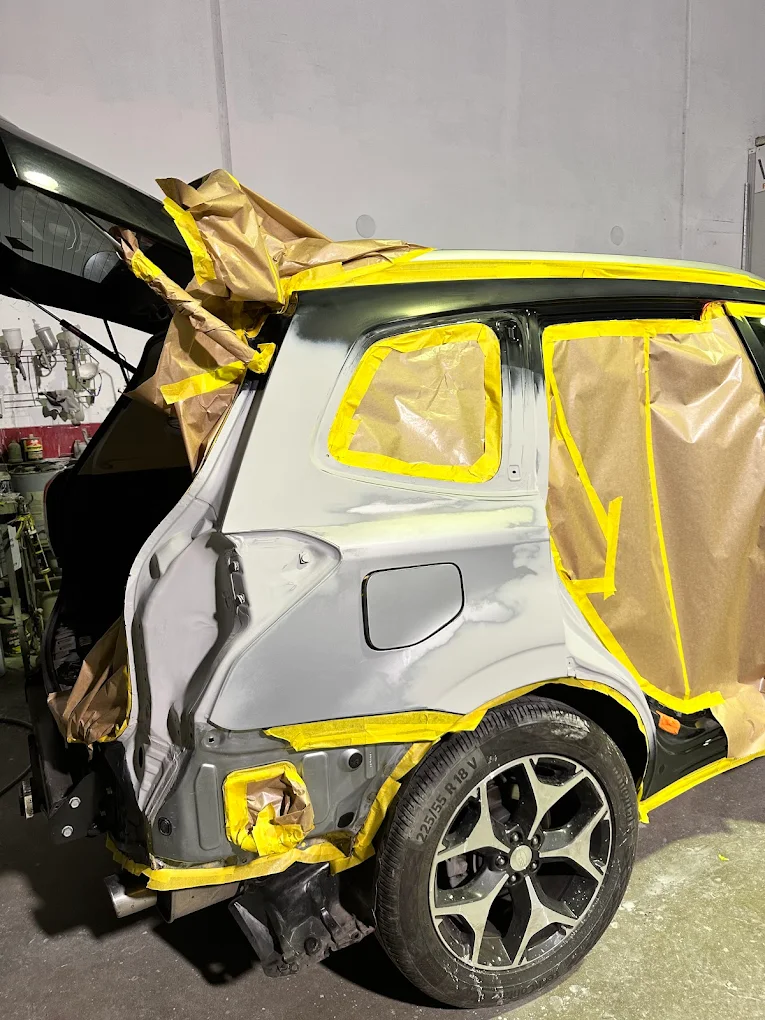 Paint preparation — panel masked for respray